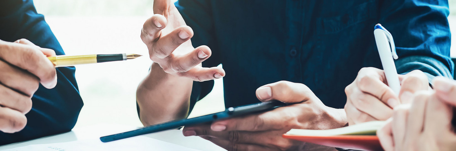 A group of business people sitting at a table