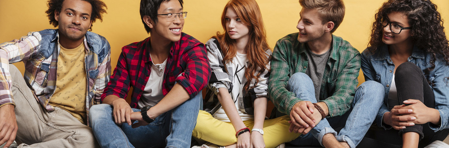 A group of young people sitting